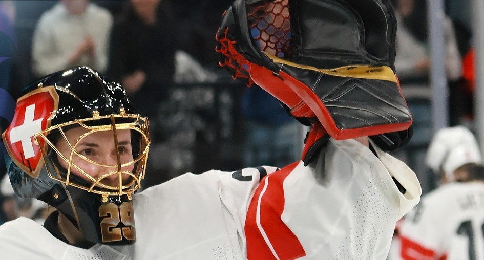 Switzerland women's hockey goaltender Saskia Maurer waves her glove during an Olympic game.