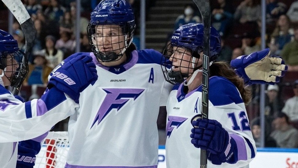 Minnesota Frost players celebrate a goal.